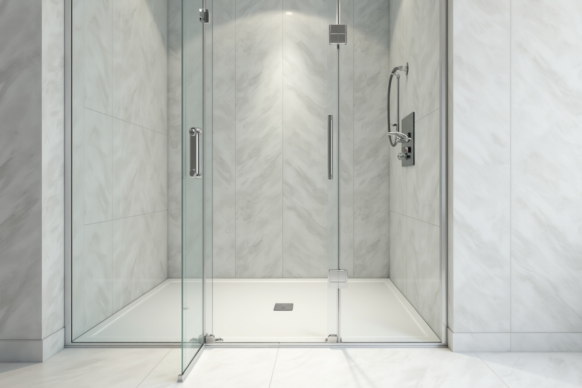 Bathroom interior design showing frameless glass shower with clean sealed edges at wall junctions demonstrating professional installation that prevents water leaks