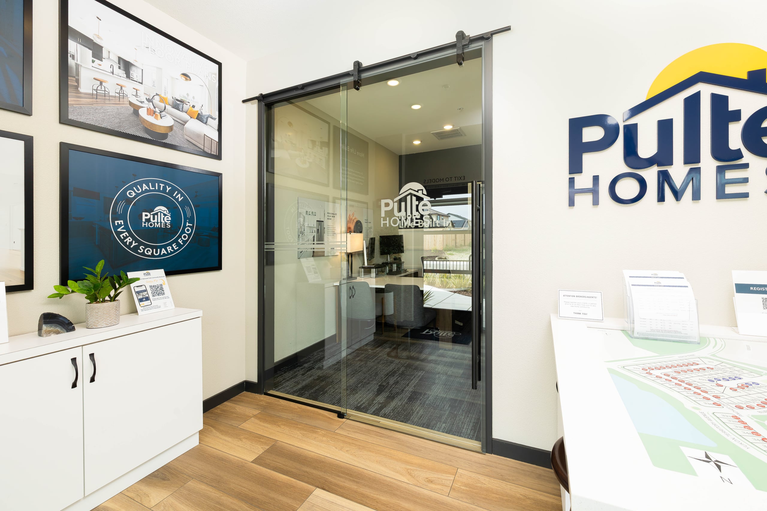 Pulte Homes Design Center commercial storefront with full-height aluminum-framed glass entry — an Infinity Glass & Glazing installation